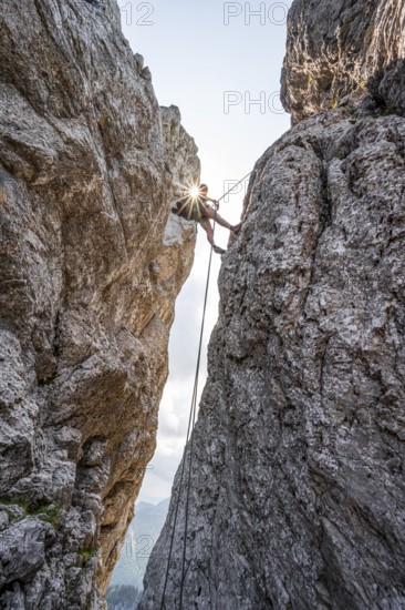 Climber on a climbing tour, abseiling, alpine climbing, crossing the Kampenwand, Sonnenstern,