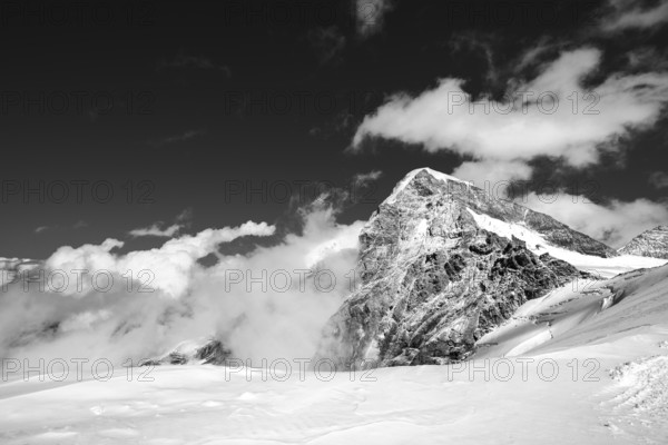 Snow mountains, the Swiss alps, Jungfrau Joch and glacier in black and white landscape.