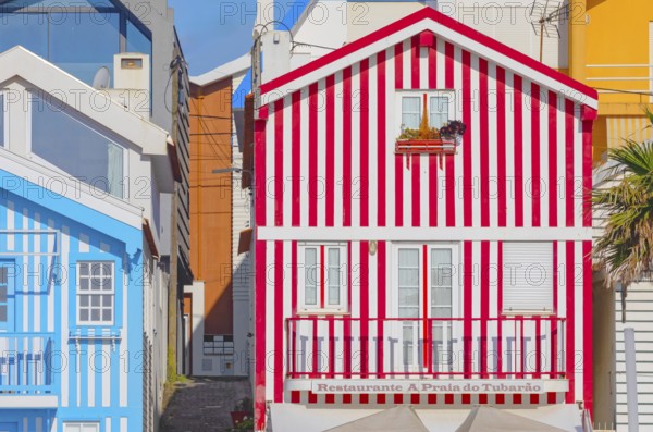 Brightly painted beach homes, Costa Nova do Prado, Aveiro, Portugal, Europe