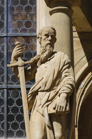 Laurentiuskirche, Protestant church, portal with apostle Paul with sword, stone figure, statue,