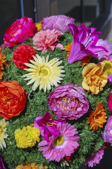 Fabric flowers in front of shop, artificial flowers, colourful textile flowers, Reutlingen,