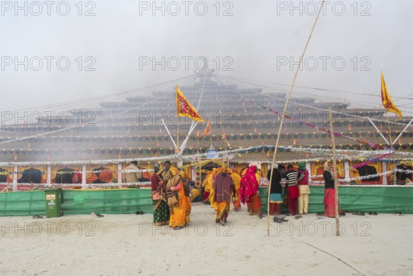 Devotees offer prayers at a makeshift Havan place on the eve of consecration ceremony of the Ram