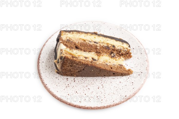 Chocolate biscuit cake with caramel cream isolated on white background. side view