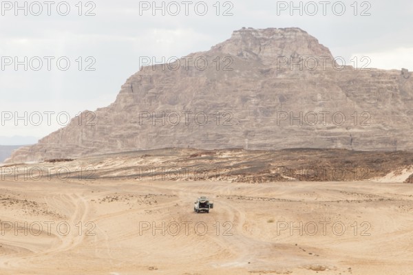 Desert, red mountains, rocks and cloudy sky. Egypt, color canyon, the Sinai Peninsula, Dahab