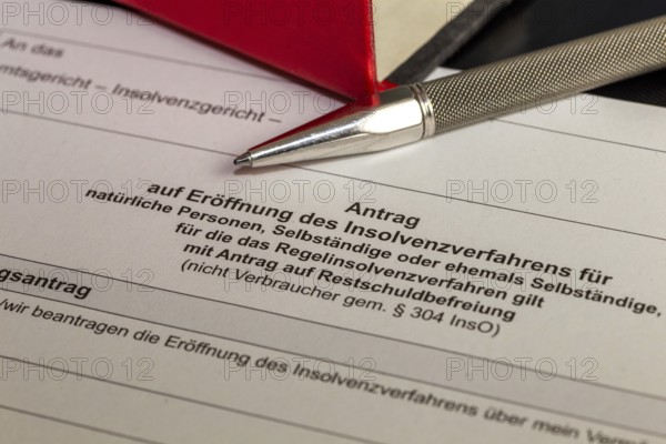 Symbolic image of insolvency: close-up of an application to open insolvency proceedings