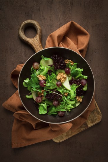 Fresh salad, waldorf, celery stalk, with apple and walnut, grapes, herbs, homemade, no people