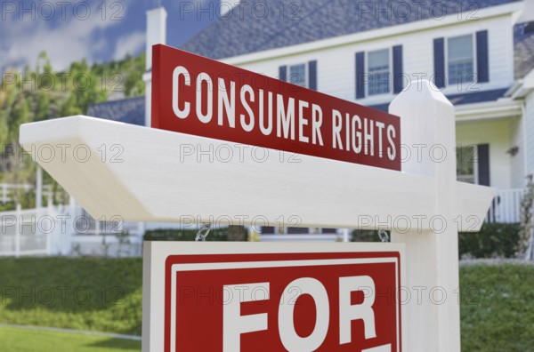 Consumer rights for sale real estate sign in front of new house