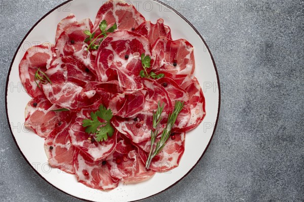 Sliced cured ham, prosciutto, italian dish, delicacy, parma ham, top view, no people