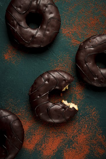 Donuts with cocoa, in chocolate glaze, top view, no people