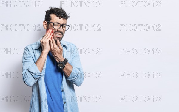 A man suffering from toothache isolated, People with toothache, person with hand on cheek with