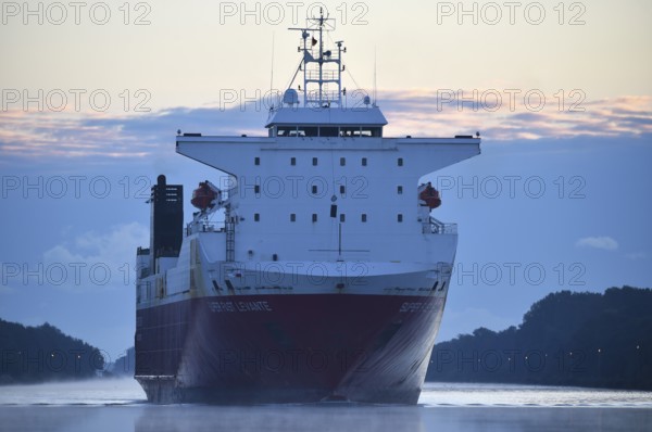 RoRo cargo ship Super Fast Levante travelling through the Kiel Canal at sunrise, Kiel Canal,