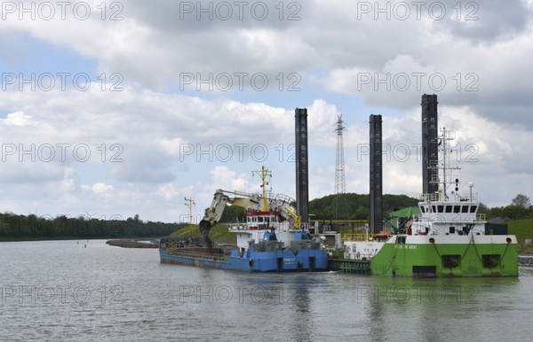 Working with a dredger on the Kiel Canal to widen the canal, Kiel Canal, Schleswig-Holstein,