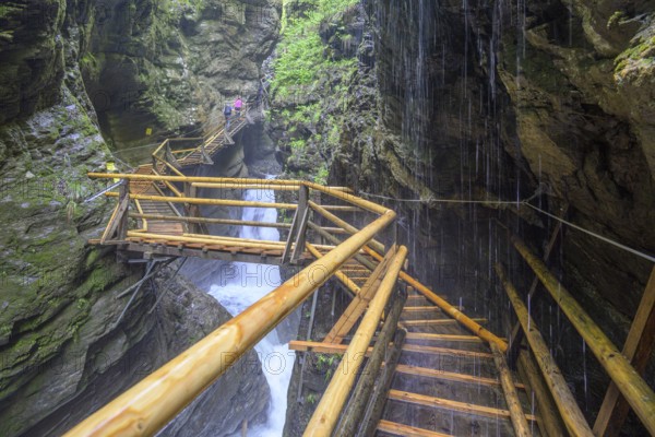 Water falls down on the climbing facility in the Raggaschlucht gorge, Flattach, Carinthia, Austria,