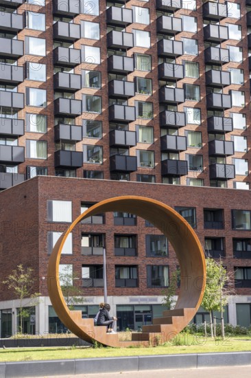 Walk-in steel sculpture on Maashaven Noordzijde Street, new high-rise residential buildings in the