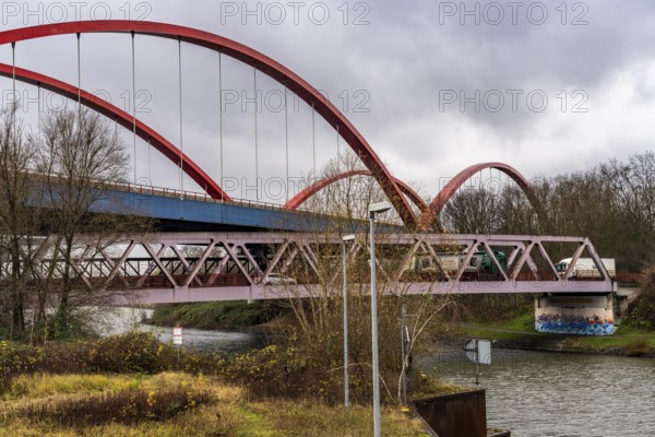 Dilapidated A42 motorway bridge (red arches) over the Rhine-Herne Canal, with massive structural