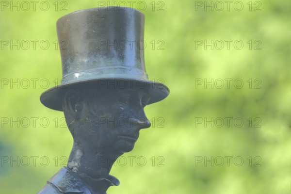 Man with top hat and historical Biedermeier clothing at the Datterich fountain, headgear, hat,