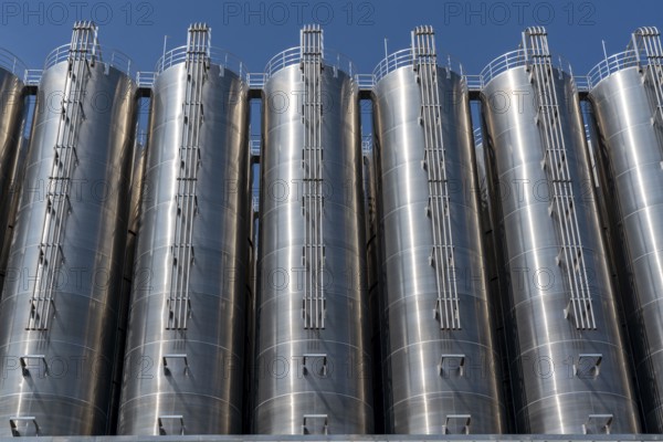 Stainless steel tanks of a large silo facility in Duisburg inland harbour, Duisburg-Neuenkamp, for