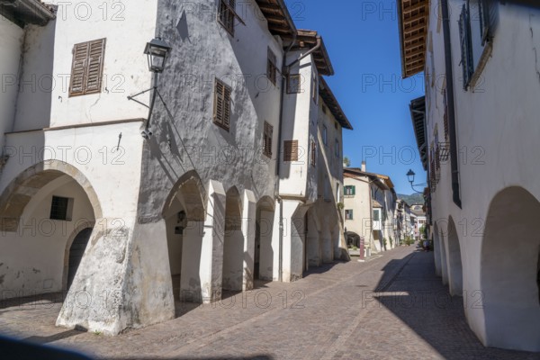 The town of Neumarkt, in the Adige Valley, in South Tyrol, arcades in the old town centre, in front