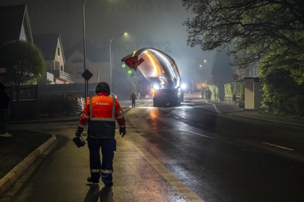 Transport of a 68 metre long, 22 tonne blade of a wind turbine, here in Breckerfeld, with a