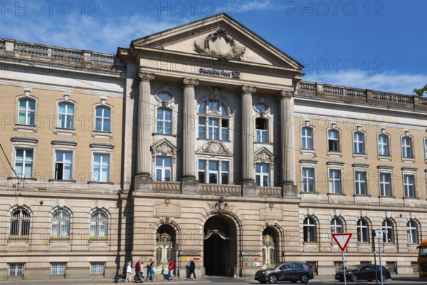 Magnificent entrance to a building with imposing façade and columns, former post office building,