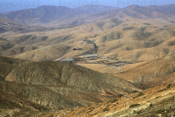 Bare moon-like arid landscape in mountains between Pajara and La Pared, Fuerteventura, Canary