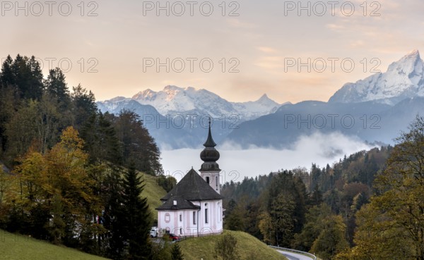 Maria Gern pilgrimage church at sunrise, behind Schönfeldspitze and the Watzmann, in autumn,