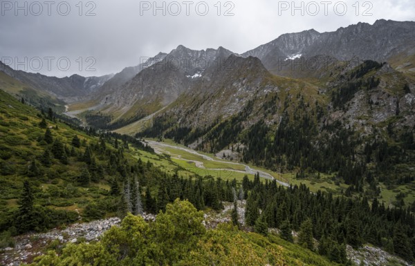 Green mountain valley with river and steep mountain peaks, Chong Kyzyl Suu Valley, Terskey Ala Too,