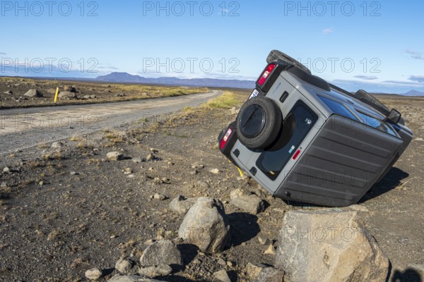 Crashed car, lying on its side, road 864 connecting ring road no.1 with eastern side of Dettifoss