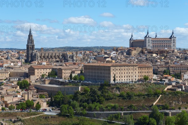 View of Toledo with historic buildings, a cathedral and trees under a blue sky, Cathedral,