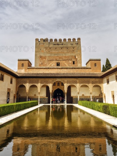 Myrtle courtyard with water basin and Torre de Comares, arabesque Moorish architecture, Nasrid