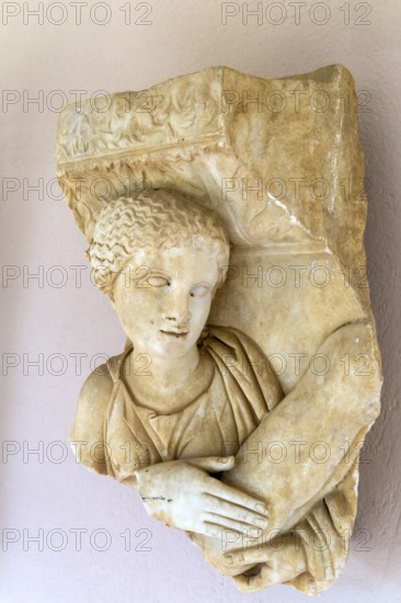 Carved detail of marble sarcophagus figure, Roman archaeology museum, Apollonia Archaeological