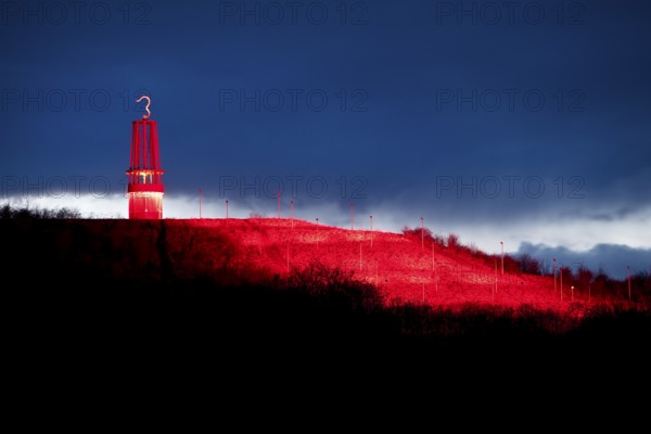 Artwork Illuminated at night with red illuminated slagheap Rheinpreussen by Otto Piene, Moers, Ruhr