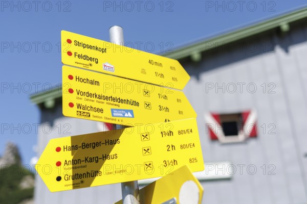 A signpost at the Stripsenjochhaus indicates hiking destinations. Taken in Kirchdorf, 15.07.2024