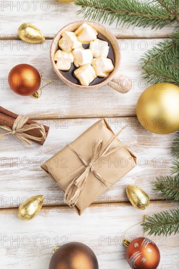 Christmas or New Year composition. Decorations, box, golden balls, cinnamon, fir and spruce