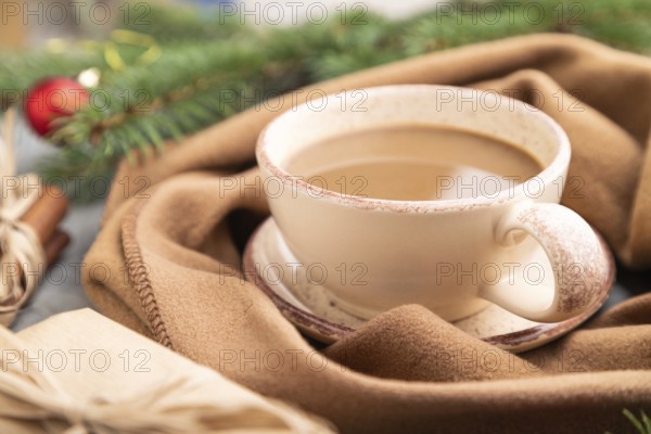 Christmas or New Year composition. Decorations, box, cinnamon, fir and spruce branches, cup of