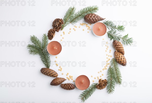 Christmas or New Year wreath composition. Decorations, cones, candles, fir and spruce branches, on