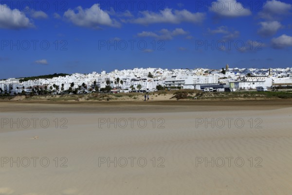 Sandy beach and village of Conil de la Frontera, Cadiz Province, Spain, Europe