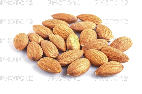 Pile of almonds isolated on white background. close up