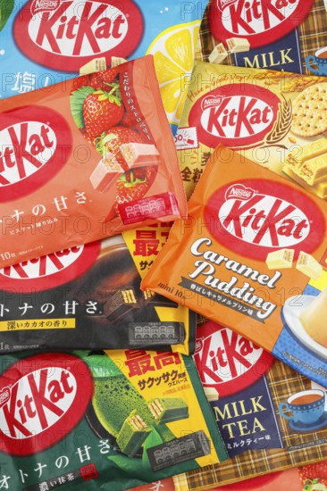 Various flavours of KitKat Kit Kat chocolate bar from Japan by Nestle as a background