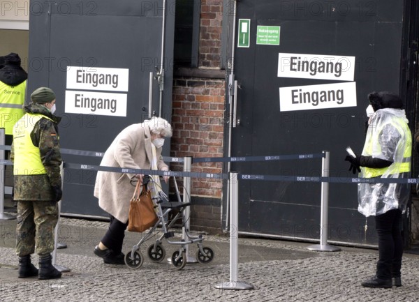 An elderly woman arriving at the vaccination centre in the Arena in Treptow, Berlin, 09.02.2021