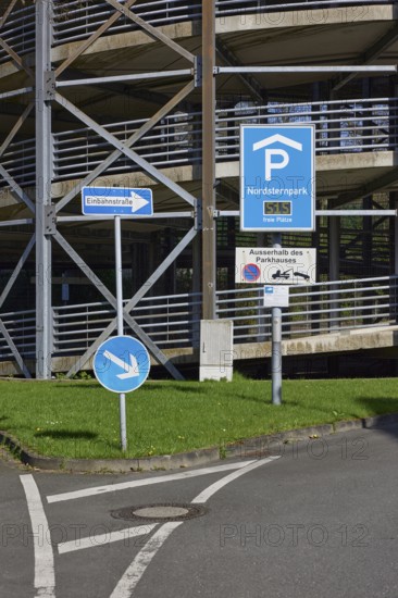 Traffic sign for the multi-storey car park and one-way street sign in Nordsternpark, Gelsenkirchen,