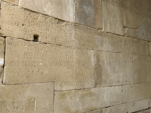 Detailed view of sandstone blocks Stones made of sandstone with written laws carved into the wall