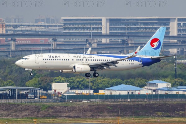 A Boeing 737-800 aircraft of Hebei Airlines with the registration number B-1971 at Hongqiao Airport