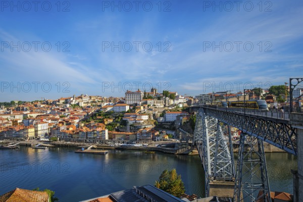 View of Porto city and Douro river and Dom Luis bridge I with metro tram from famous tourist