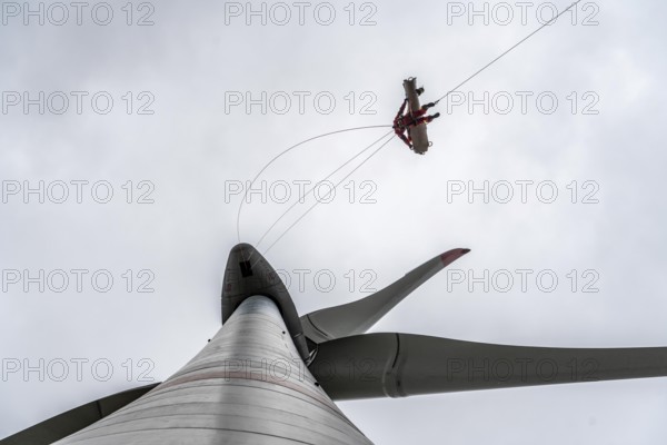 Height rescuers from the Oberhausen professional fire brigade practise abseiling from a wind