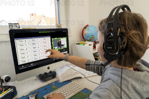 Young, primary school pupils, home learning, doing schoolwork, distance learning, virtual