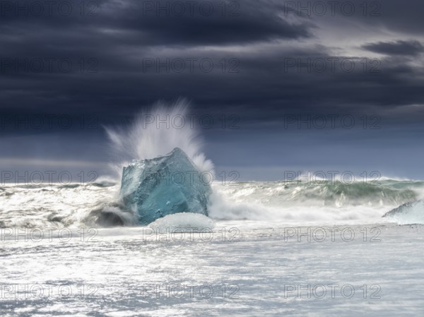 Diamond Beach, iceberg in the surf, near Jökulsarlon glacier lagoon, Vatnajökull National Park,