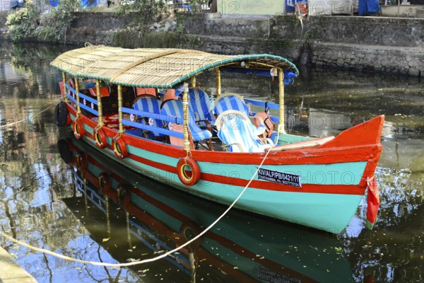 Fort Cochin, Cochin, Kerala, South India, India, Asia, Colourful traditional boat on calm canal