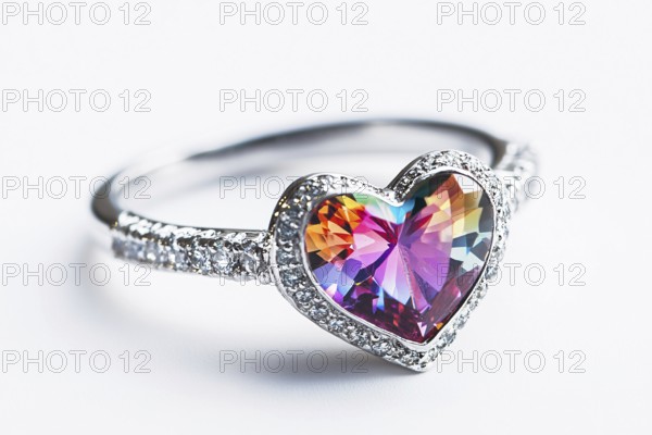 Silver Valentine's day ring with colorful heart shaped gem stone on white background. Generative