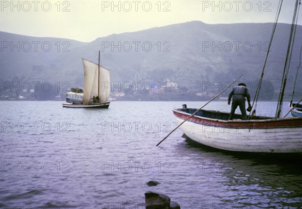 Morales Mofalito's bus on the ferry across Lake Titicaca, Bolivia, South America, 1962, arrival